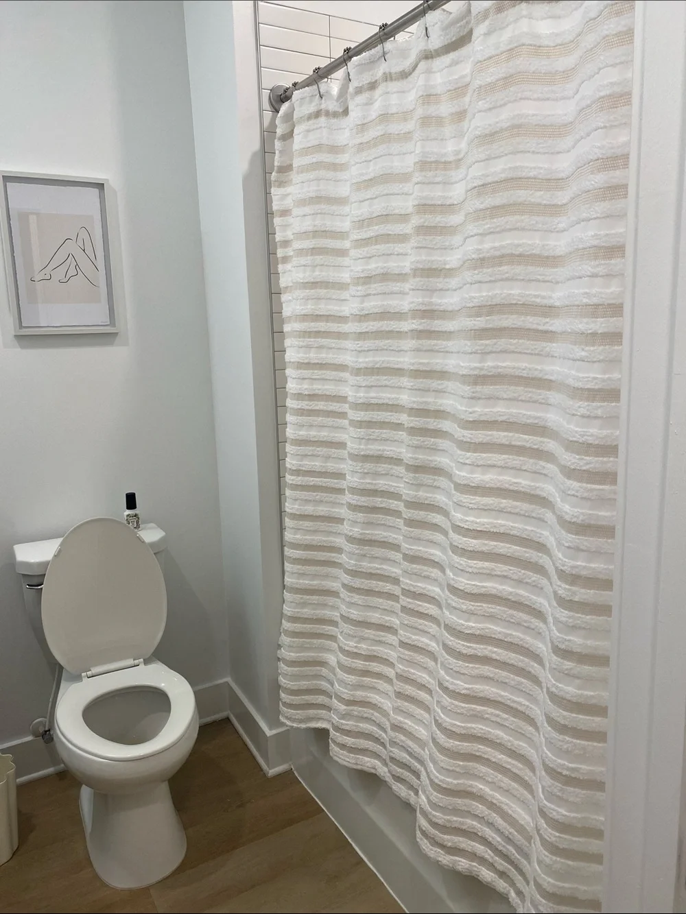 Cream and white striped shower curtain